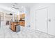 Kitchen island features stainless steel appliances and dining area in background at 733 Seminole Blvd, Tarpon Springs, FL 34689