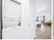 View of laundry and bedroom featuring wood floors and bright airy lighting at 733 Seminole Blvd, Tarpon Springs, FL 34689