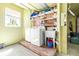 Bright laundry room equipped with modern washer and dryer, and a utility sink at 733 Seminole Blvd, Tarpon Springs, FL 34689