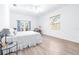 Spacious main bedroom with natural light and wood-look flooring at 733 Seminole Blvd, Tarpon Springs, FL 34689