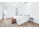Airy main bedroom with wood-look flooring and a neutral color palette at 733 Seminole Blvd, Tarpon Springs, FL 34689