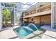 Stunning screened-in pool with a fountain and a spacious lounging area at 733 Seminole Blvd, Tarpon Springs, FL 34689