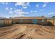 Spacious backyard showing slider doors, wood fence and newly cleared earth at 7505 Exter Way, Tampa, FL 33615
