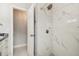 Shower with stylish white tile and modern fixtures at 7505 Exter Way, Tampa, FL 33615