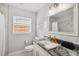 Bathroom features a modern vanity with granite countertop at 7505 Exter Way, Tampa, FL 33615