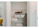 Organized linen closet stocked with fresh towels, linens and ironing board at 7505 Exter Way, Tampa, FL 33615