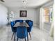 Inviting dining space featuring modern décor, including statement lighting, adjacent to a cozy lounge area at 7505 Exter Way, Tampa, FL 33615