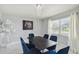 Dining room area with window, and blue velvet dining room chairs at 7505 Exter Way, Tampa, FL 33615