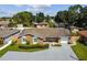 Inviting single story home featuring a well-manicured lawn and a convenient attached two car garage at 7505 Exter Way, Tampa, FL 33615