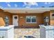Attractive front entrance features white brick columns, lanterns, and a welcoming paver walkway at 7505 Exter Way, Tampa, FL 33615