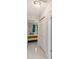 Hallway view showcases bedroom and closet with crystal chandelier at 7505 Exter Way, Tampa, FL 33615