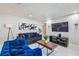 Bright living room featuring modern decor and a comfortable sofa with decorative pillows at 7505 Exter Way, Tampa, FL 33615