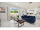 Inviting living room open to the modern kitchen; perfect for entertaining guests at 7505 Exter Way, Tampa, FL 33615
