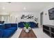Bright living room featuring modern decor and a comfortable sofa with stylish pillows at 7505 Exter Way, Tampa, FL 33615