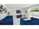 Bright living room featuring modern decor, tile floors, and natural light at 7505 Exter Way, Tampa, FL 33615
