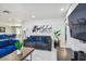 Spacious living room featuring modern decor, plush sofas, and an open view to the dining area at 7505 Exter Way, Tampa, FL 33615