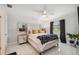 Main bedroom with accent wall, ceiling fan and a bright window at 7505 Exter Way, Tampa, FL 33615