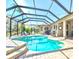 A screened in pool with brick pavers is perfect for outdoor fun and entertaining at 7546 Dunbridge Dr, Odessa, FL 33556