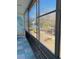 Balcony view highlighting the screened-in porch, offering a glimpse of the surrounding greenery and natural light at 8220 112Th St # 202, Seminole, FL 33772