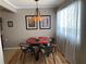 Cozy dining room with a round table, chairs, and a decorative light fixture at 8220 112Th St # 202, Seminole, FL 33772