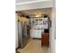 Functional kitchen with stainless steel appliances, ample storage, and decorative shelving at 8220 112Th St # 202, Seminole, FL 33772