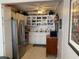 Functional kitchen with stainless steel appliances, ample storage, and decorative shelving at 8220 112Th St # 202, Seminole, FL 33772