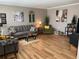 Cozy living room featuring a comfortable gray sofa, hardwood floors, and stylish decor at 8220 112Th St # 202, Seminole, FL 33772