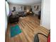 Spacious living room featuring hardwood floors, gray sofas, and stylish decor at 8220 112Th St # 202, Seminole, FL 33772