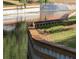 View of a pond with a retaining wall and two ducks, one adult and one duckling at 8220 112Th St # 202, Seminole, FL 33772