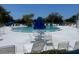 Community pool featuring ample poolside seating and shaded areas, perfect for relaxation and social gatherings at 8220 112Th St # 202, Seminole, FL 33772