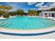 Community pool providing a refreshing and scenic space for relaxation and social gatherings with poolside seating at 8220 112Th St # 202, Seminole, FL 33772