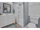 Modern bathroom with a glass enclosed shower, sleek vanity, and contemporary fixtures for a spa-like feel at 100 4Th S Ave # 208, St Petersburg, FL 33701