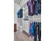 Well-organized walk-in closet with custom shelving and ample storage for clothes and accessories at 100 4Th S Ave # 208, St Petersburg, FL 33701