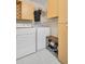 Convenient laundry area equipped with a washer, dryer, and storage, making chores a breeze at 100 4Th S Ave # 208, St Petersburg, FL 33701
