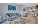 Inviting living room with stylish decor, wood floors, and a comfortable sofa and adjacent dining area at 100 4Th S Ave # 208, St Petersburg, FL 33701