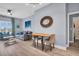 Bright living room boasts modern decor, a comfortable sofa, and an adjacent dining area with great natural light at 100 4Th S Ave # 208, St Petersburg, FL 33701
