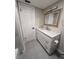 Modern bathroom with marble countertops, new lighting, fixtures and cabinet hardware at 1000 49Th N St # 309, St Petersburg, FL 33710