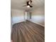 Bedroom features wood flooring, neutral paint, modern ceiling fan and a closet for clothing or storage at 1000 49Th N St # 309, St Petersburg, FL 33710