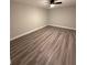 Bright bedroom with wood flooring and a modern ceiling fan, offering a comfortable space at 1000 49Th N St # 309, St Petersburg, FL 33710