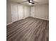 Bedroom features new flooring, neutral paint, a ceiling fan, and lots of storage space with 3 closets at 1000 49Th N St # 309, St Petersburg, FL 33710