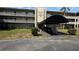 Exterior of a condo building, featuring well maintained landscaping and covered mailboxes and entry point at 1000 49Th N St # 309, St Petersburg, FL 33710