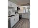 This kitchen is updated with new stainless steel appliances, white cabinets and a new faucet and counter tops at 1000 49Th N St # 309, St Petersburg, FL 33710
