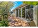 Spacious back deck with seating area and sliding glass doors offer seamless indoor-outdoor living at 1006 Osprey Ct, Tarpon Springs, FL 34689