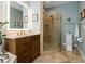 Bathroom featuring glass shower, vanity with sink, and toilet at 1006 Osprey Ct, Tarpon Springs, FL 34689