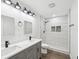 Elegant bathroom with a marble-tiled shower and modern vanity at 1008 E Norfolk St, Tampa, FL 33604