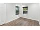 Empty bedroom with hardwood floors, modern fixtures, and lots of natural light at 1008 E Norfolk St, Tampa, FL 33604