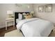 Comfortable bedroom featuring a plush bed, side tables, and modern decor at 1008 E Norfolk St, Tampa, FL 33604