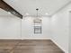 Inviting dining area with wood-look floors, modern lighting fixture, and lots of natural light at 1008 E Norfolk St, Tampa, FL 33604