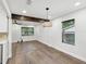 Bright and airy dining room features stylish lighting, hardwood floors, and lots of natural light at 1008 E Norfolk St, Tampa, FL 33604