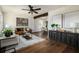 Bright living room featuring hardwood floors, modern decor, and an open floor plan at 1008 E Norfolk St, Tampa, FL 33604